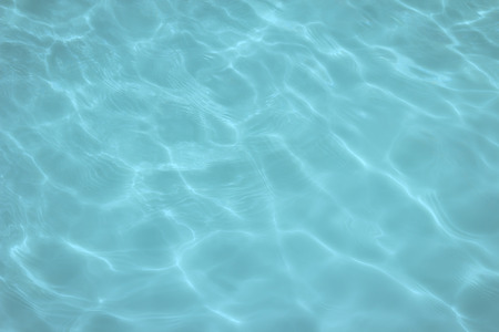 swimming pool with sunny reflections の写真素材