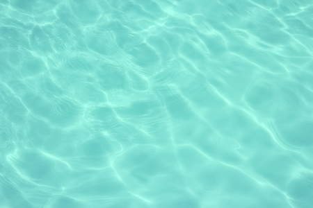 swimming pool with sunny reflections の写真素材
