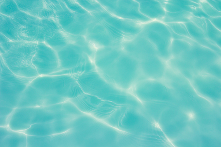 swimming pool with sunny reflections backgroundの写真素材