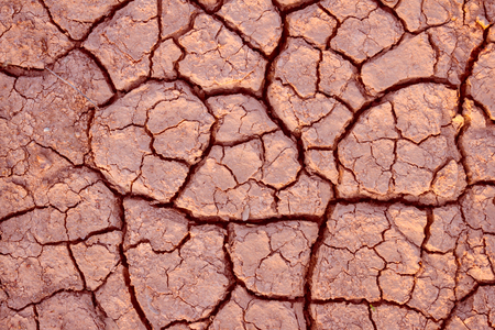 cracks in the ground backgroundの写真素材