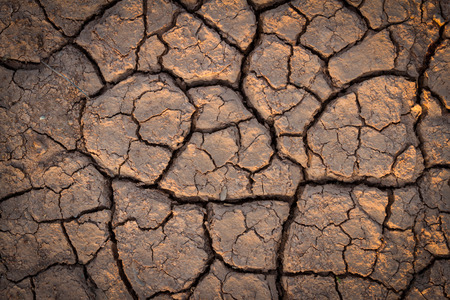 cracks in the ground backgroundの写真素材