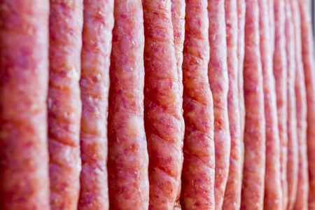 pork chinese sausage stacked in the chinese marketの写真素材