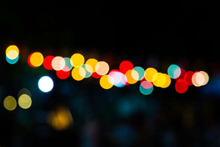 Color Bokeh against a dark の写真素材