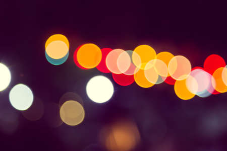 Color Bokeh against a dark の写真素材