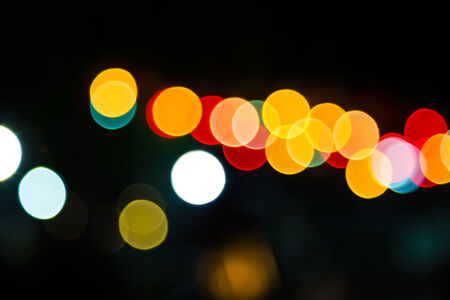 Color Bokeh against a dark の写真素材