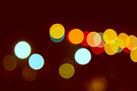 Color Bokeh against a dark backgroundの写真素材