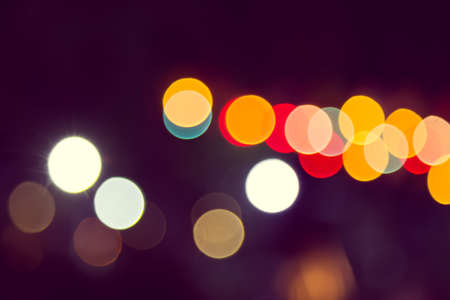 Color Bokeh against a dark backgroundの写真素材