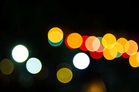 Color Bokeh against a dark backgroundの写真素材