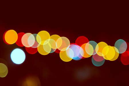 Color Bokeh against a dark backgroundの写真素材