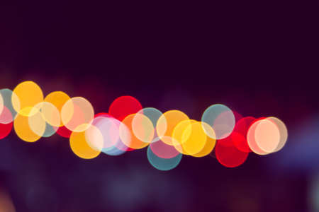 Color Bokeh against a dark の写真素材