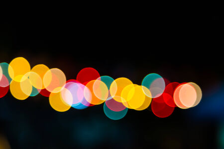 Color Bokeh against a dark の写真素材
