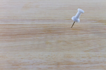 white pin on the woodbackgroundの写真素材