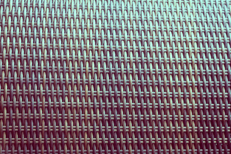 Synthetic rattan texture weaving as used on outdoor garden furniture.