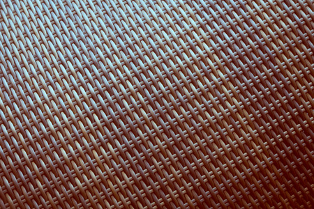 Synthetic rattan texture weaving background as used on outdoor garden furniture.の写真素材