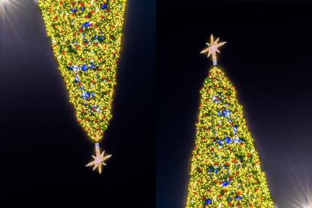 Christmas tree light with decoration on black backgroundの写真素材