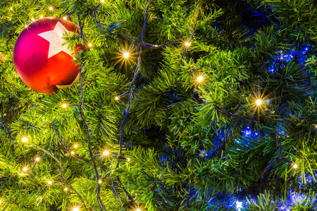 Christmas tree with colorful balls and gift backgroundの写真素材