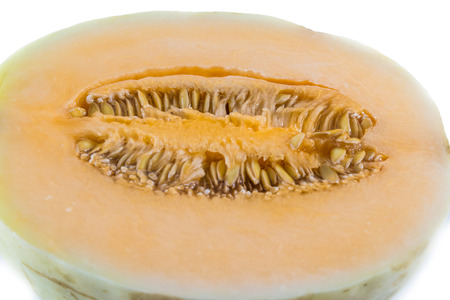 Cantaloupe, cut in half on white backgroundの写真素材