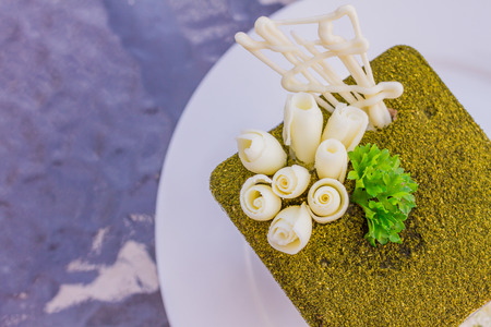 Green tea tiramisu with green tea powder  and mint leaf