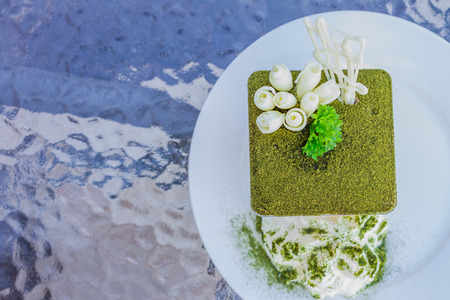 Green tea tiramisu with green tea powder  and mint leafの写真素材