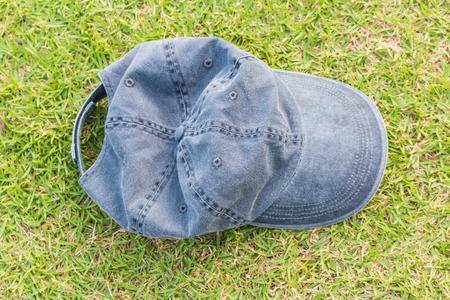 Gray hat/cap on grass backgroundの写真素材