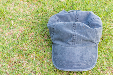 Gray hat/cap on grass backgroundの写真素材