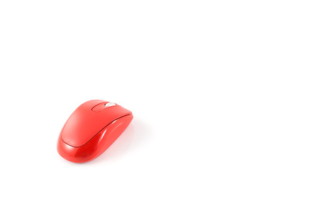 red wireless mouse on white backgroundの写真素材