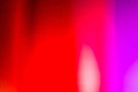 Red and pink defocused lights backgroundの写真素材