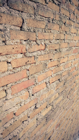 Side view of old orange vintage brick wall background