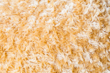 Close up of brown Faux fur fabric synthetical texture backgroundの写真素材