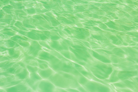 swimming pool with sunny reflections backgroundの写真素材