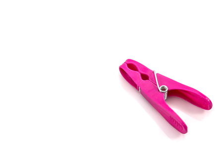 colorful plastic clothes pegs on white background