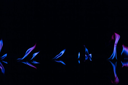Blue color fire flames on black backgroundの写真素材