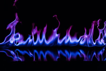 Blue color fire flames on black backgroundの写真素材