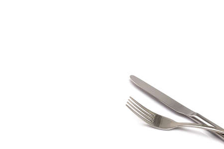 Stainless metal Knife and fork kitchenware isolated on white backgroundの写真素材