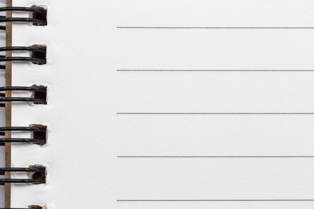 Close up of blank realistic spiral notepad notebook backgroundの写真素材