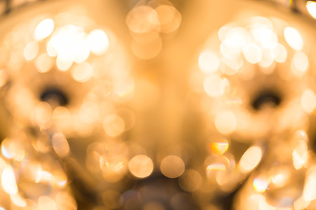 Blur Golden bokeh from beautiful crystal chandelier bokehの写真素材
