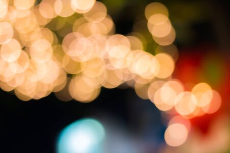 Gold color bokeh elegant abstract background with bokeh defocused lightsの写真素材