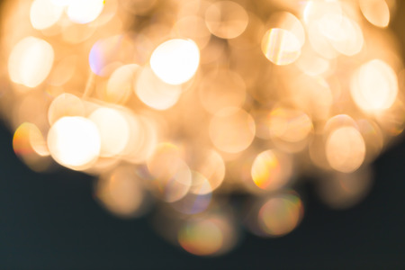 Blur Golden bokeh from beautiful crystal chandelier bokehの写真素材