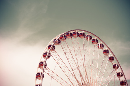 Vintage style Ferris wheel with blue sky backgroundの写真素材