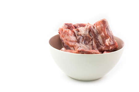 raw pork ribs on white  dish isolated on white backgroundの写真素材