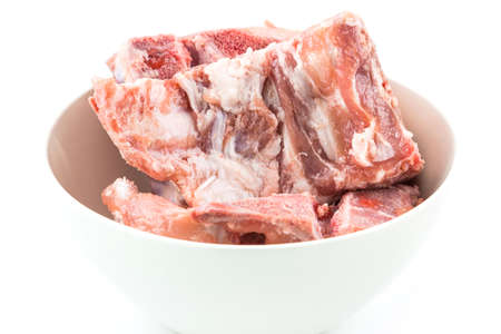 raw pork ribs on white  dish isolated on white backgroundの写真素材