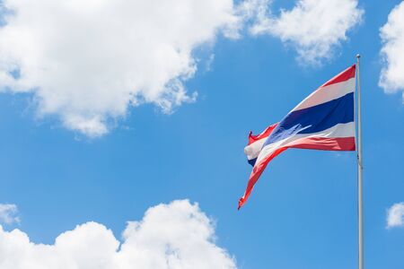 Thai flag waving on blue sky background