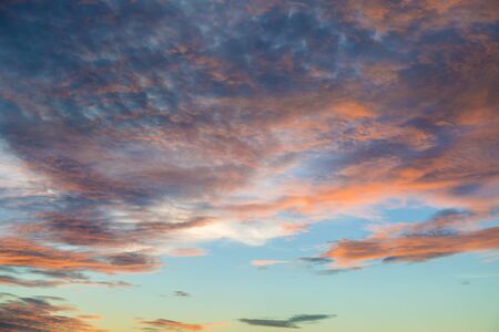Bright orange and yellow colors sunset sky / Yellow blue sunrise sky with sunlight background