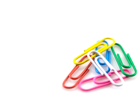 Colorful paperclips isolated on white background