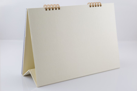 Blank desk calendar on white backgroundの写真素材