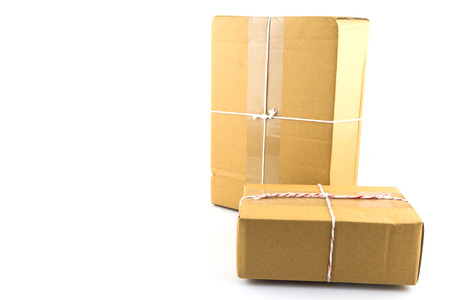 Two brown paper box  tied with red and white string ready to send isolated on white backgroundの写真素材