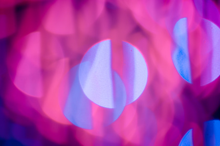 Red, pink, white, yellow and turquoise Chrismas lights bokeh backgroundの写真素材