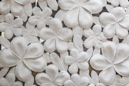 White cement  hibiscus flower stone background