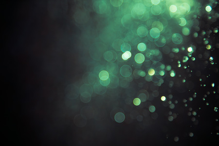 bokeh of water fly and lights on black backgroundの写真素材