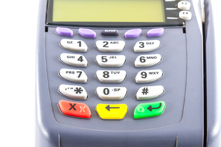 Close-up of payment machine , credit card machine isolated on white backgroundの写真素材